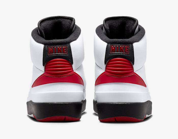 Rear view of white, red, and black Jordan shoes.